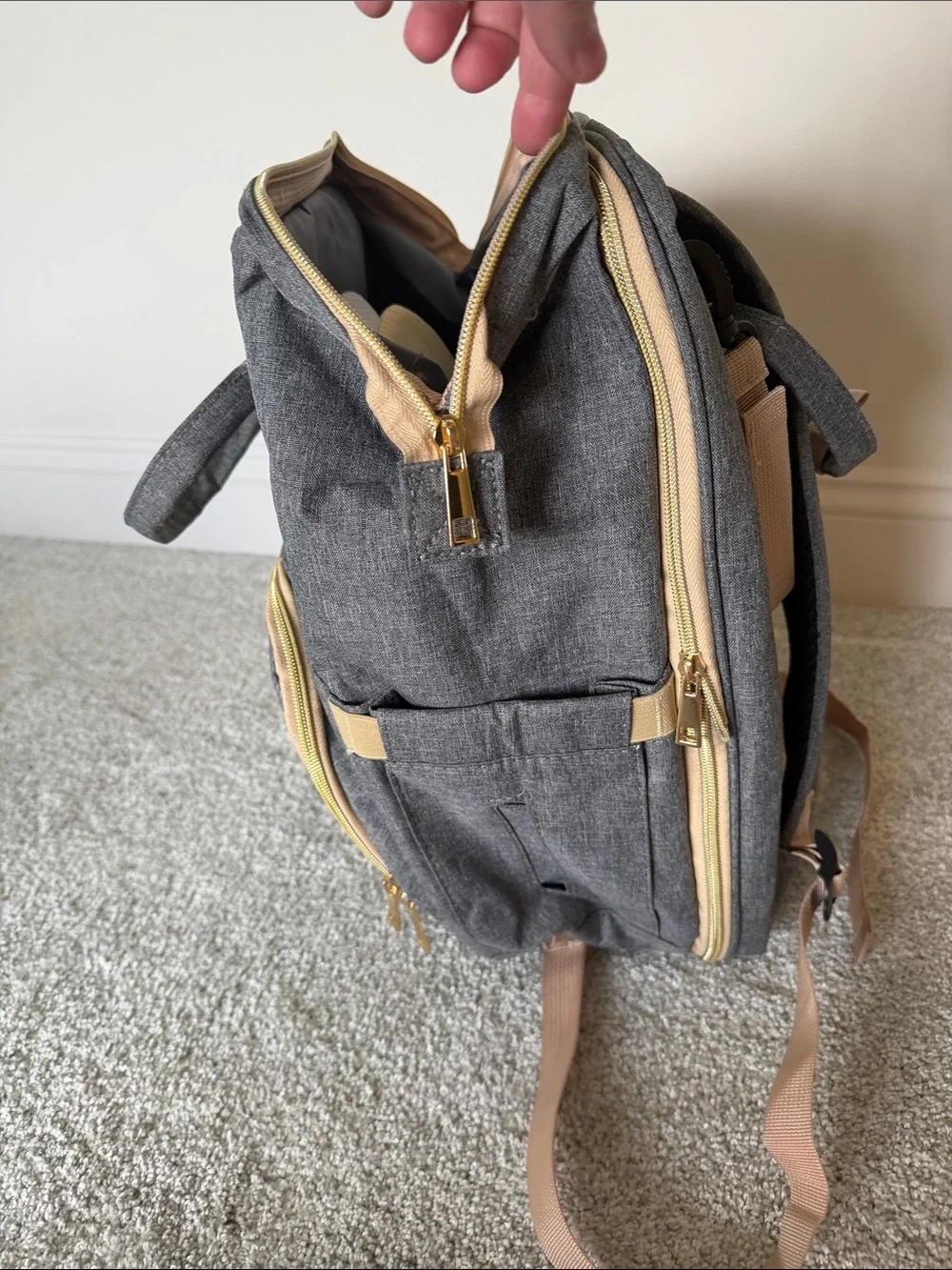 Diaper backpack with changing station